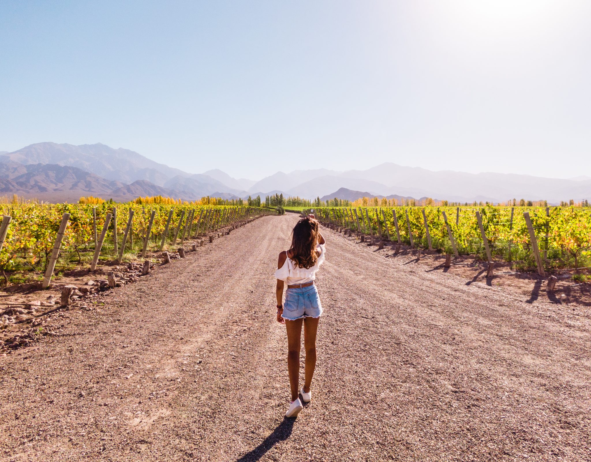 Woman,Walking,Down,Path,Leading,Towards,Nature,,View,Of,Mountain Woman,Walking,Down,Path,Leading,Towards,Nature,,View,Of,Mountain