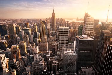 New,York,City,Skyline,With,Urban,Skyscrapers,At,Sunset,,Usa.