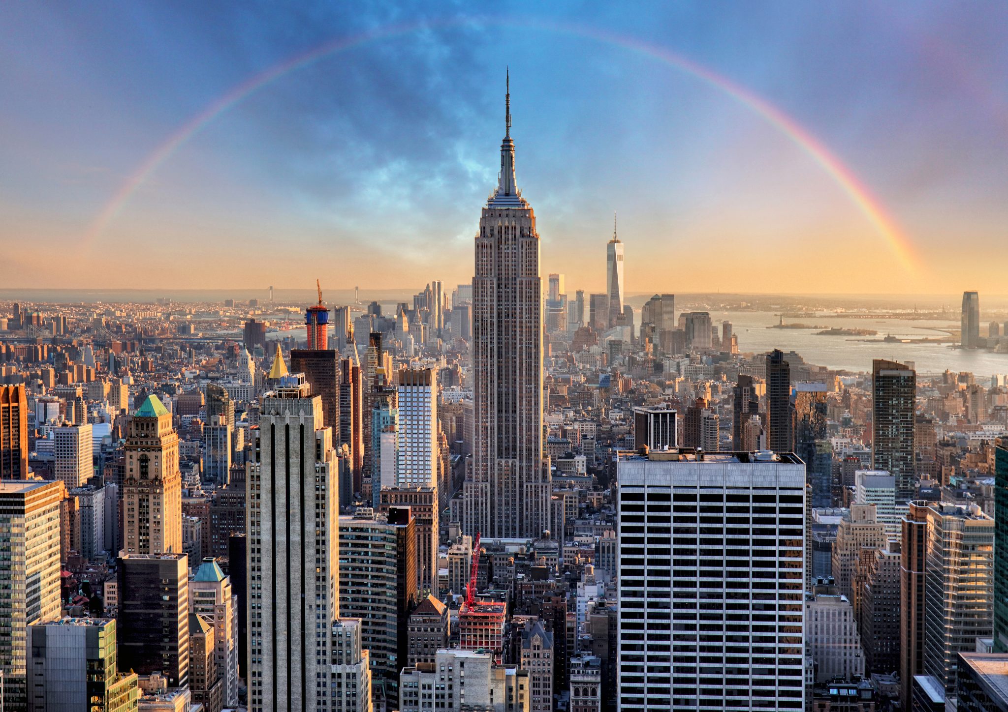New,York,City,Skyline,With,Urban,Skyscrapers,And,Rainbow. New,York,City,Skyline,With,Urban,Skyscrapers,And,Rainbow.