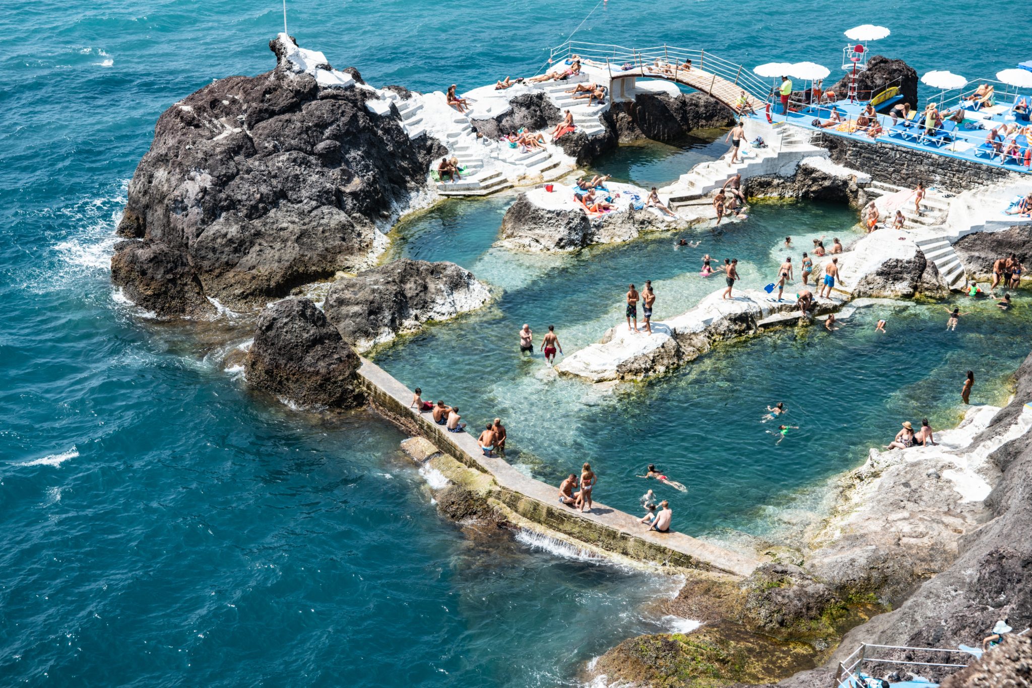 Natural,Volcanic,Swimming,Pool,With,Bathers.,The,View,From,The